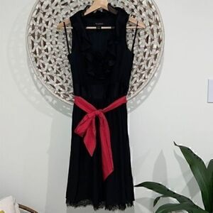 White House Black Market black lace trimmed dress with pink accent belt size 2